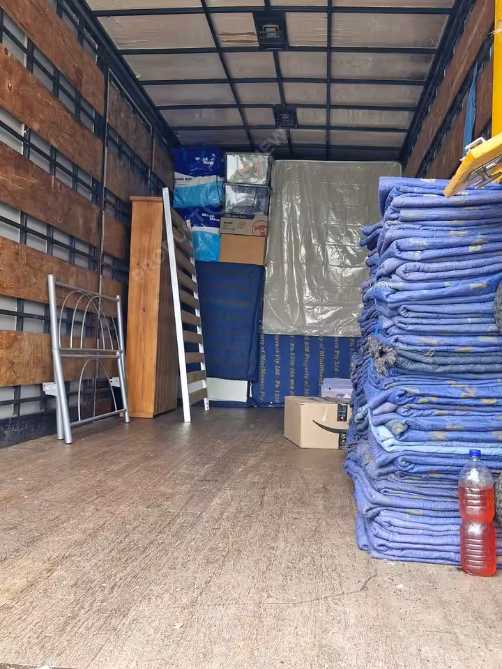 Empty moving truck with packed items