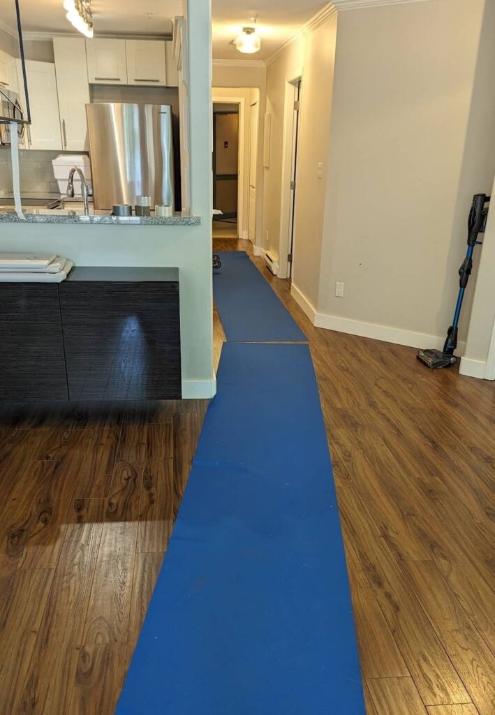 North York Movers Blue runner on wooden floor