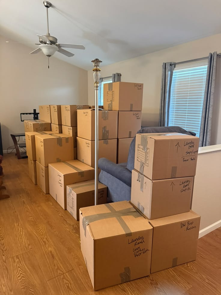 North York Movers Stacked moving boxes in living room