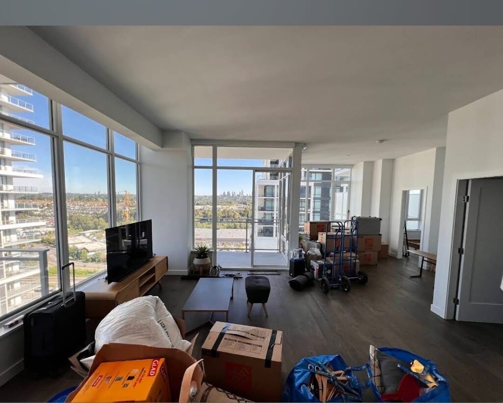 North York Movers Cluttered apartment with city view.