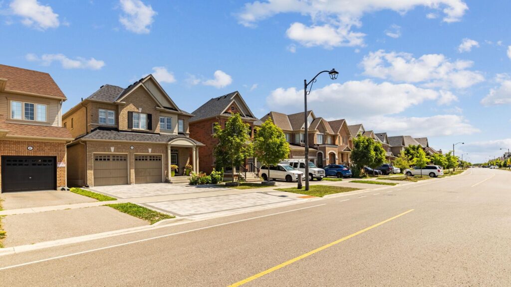 Oshawa Movers Oshawa Movers: Residential street with houses and vehicles